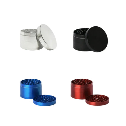 Four metal grinders in silver, black, blue, and red on a white background.