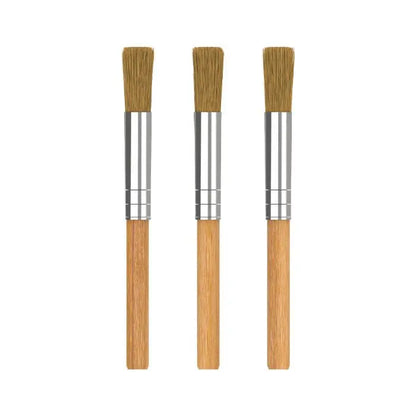 Three Storz and Bickel wooden-handled brushes with bristle heads on a white background