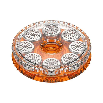 Round orange and clear plastic magazine on a white background